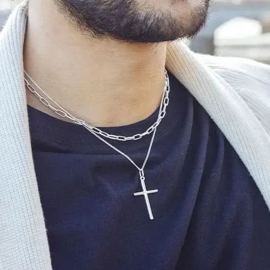 Male model wearing sterling silver cross necklace with chain