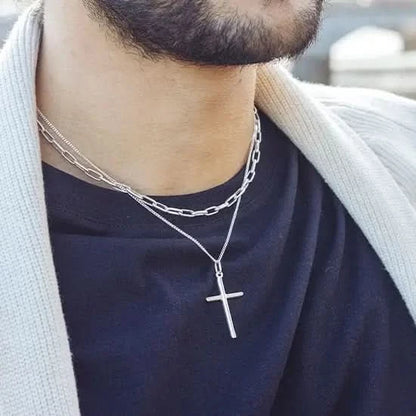model wearing silver cross necklace with chain
