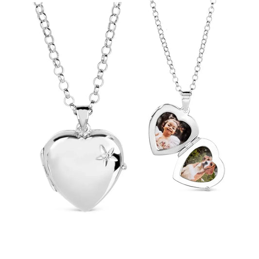 Silver diamond heart lockets hanging side by side — one closed with a small diamond star accent and one open showing two photo inserts — displayed on white background.