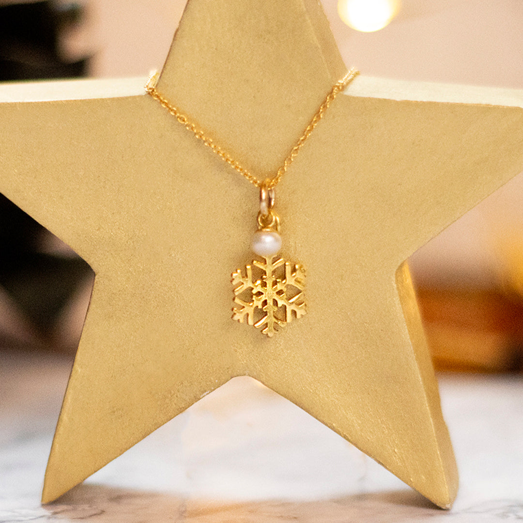 Gold snowflake and pearl necklace by Lily Blanche
