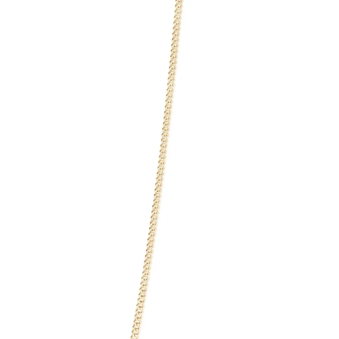 solid yellow gold curb chain on a white background