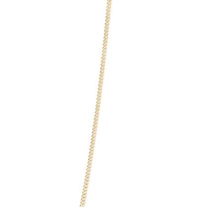 solid yellow gold curb chain on a white background