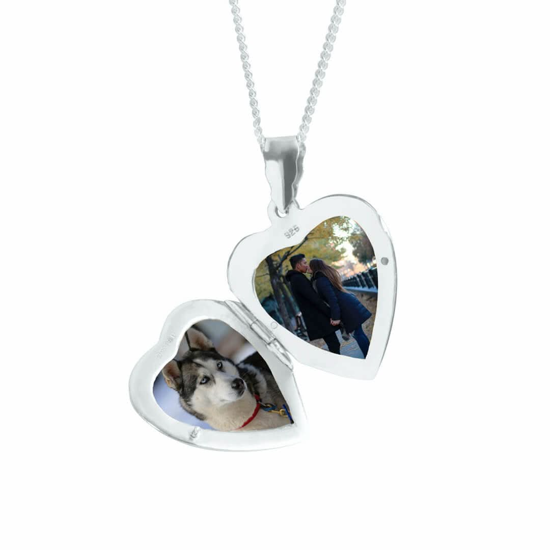 opened heart locket in white gold on a white background