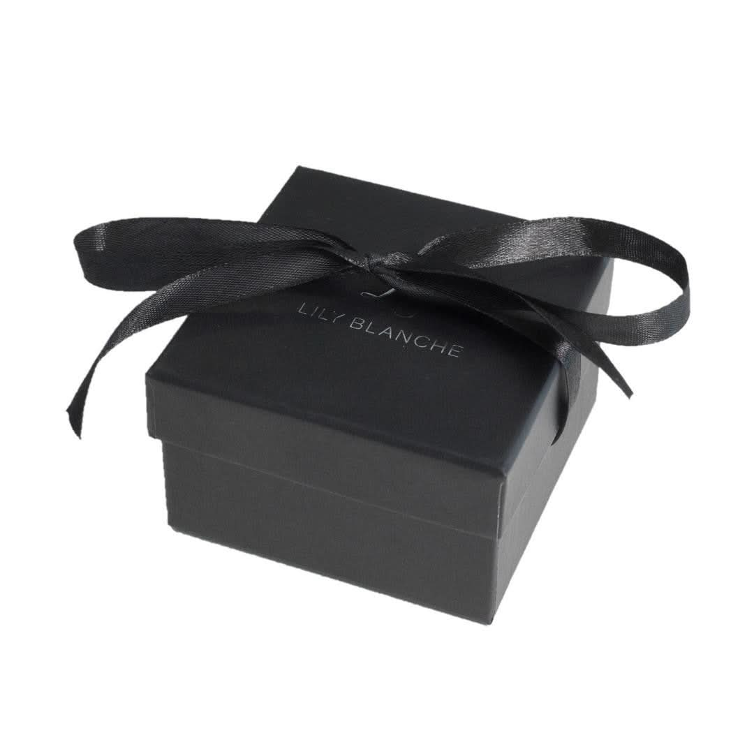 black ribbon-tied Lily Blanche gift box on a white background 