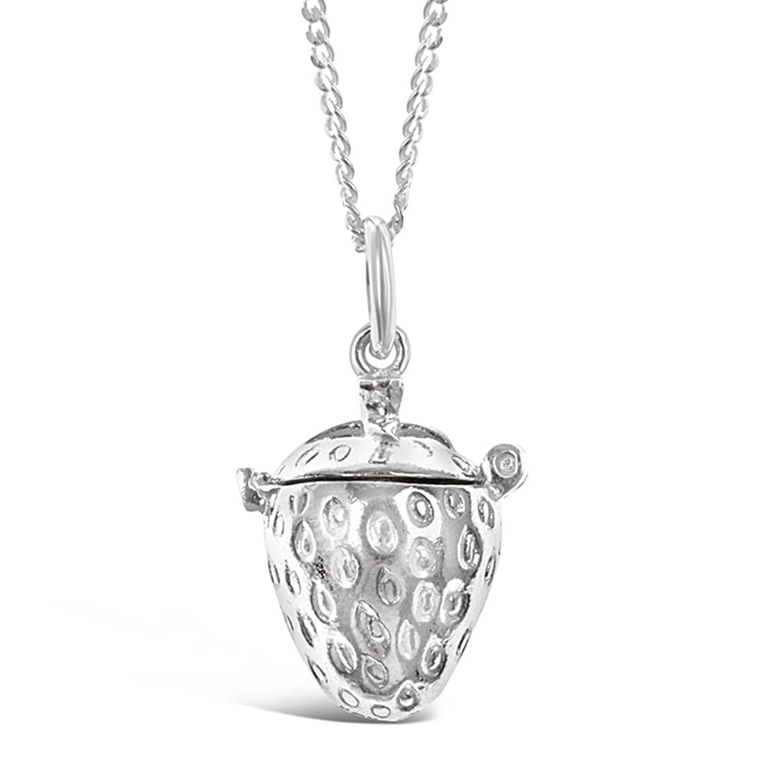 magical strawberry charm in silver on a white background