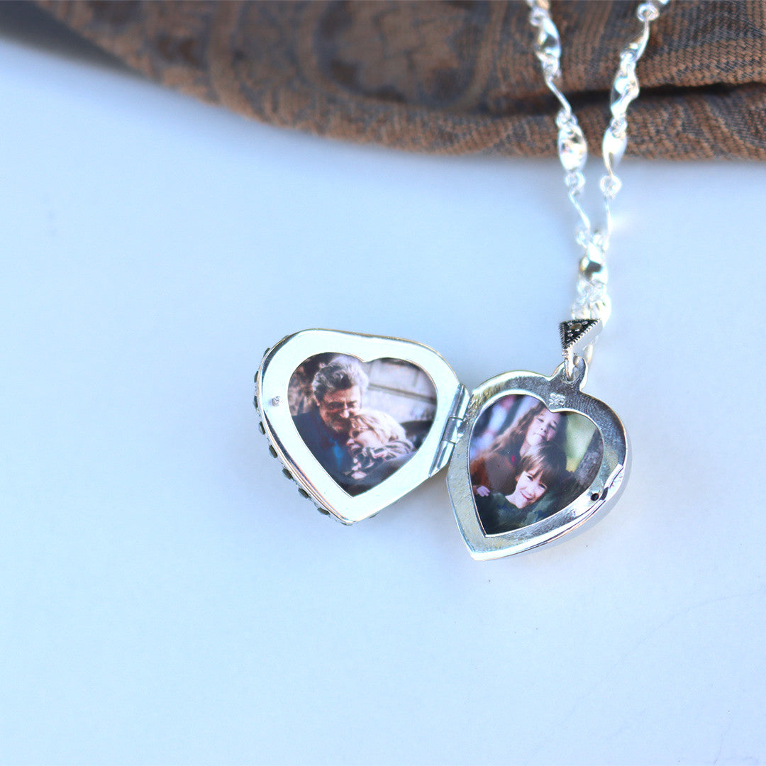 ruby vintage heart locket in silver with photos inside