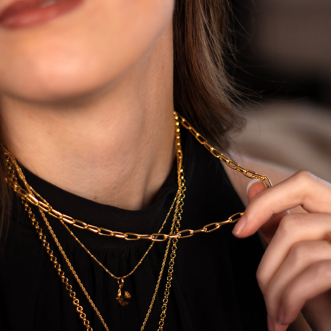model wearing paperclip chain necklace in gold 
