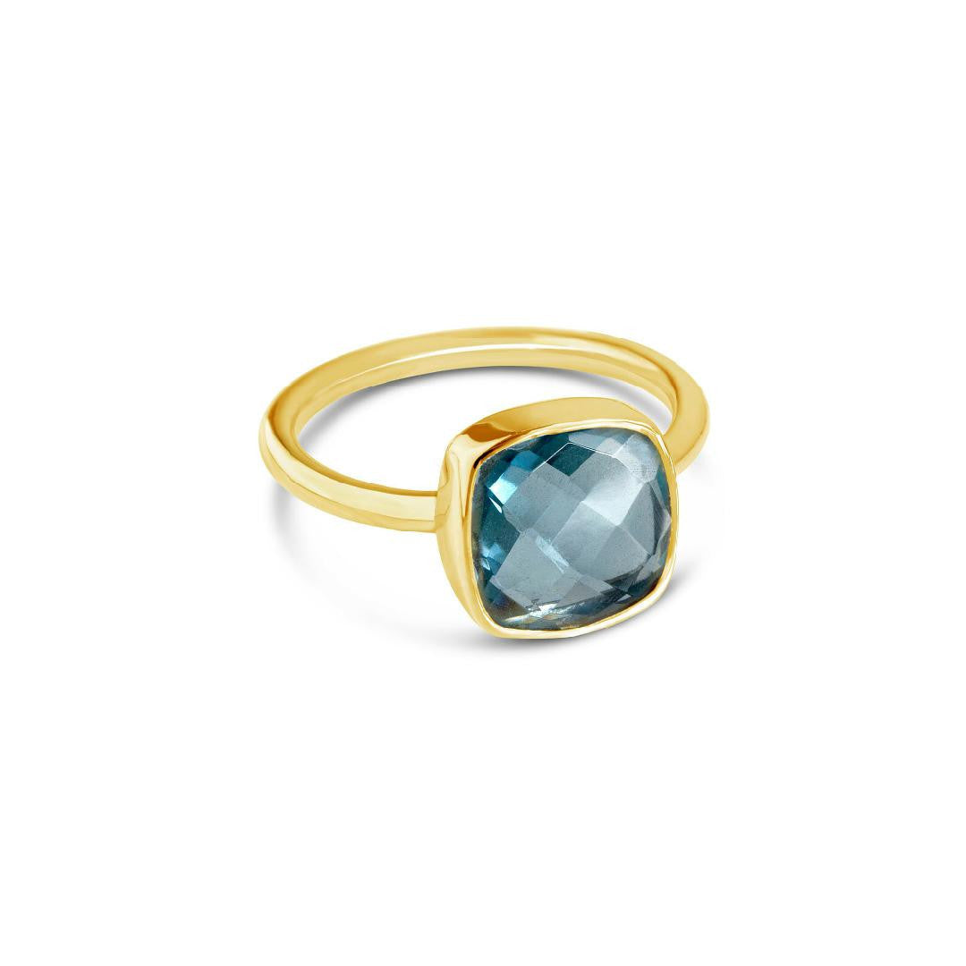  Blue blue topaz cocktail ring in gold on a white background