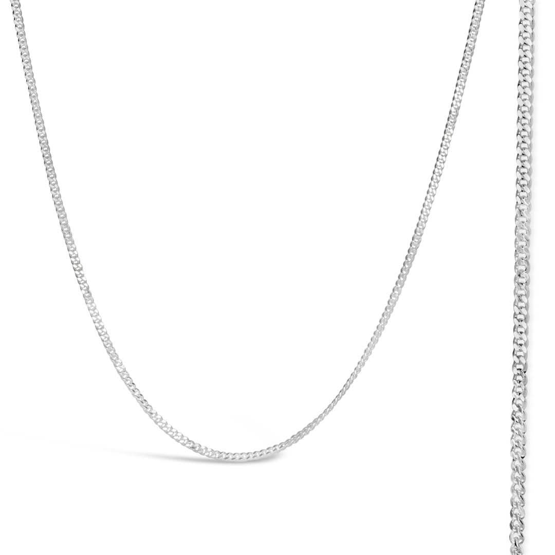 sterling silver curb chain on a white background