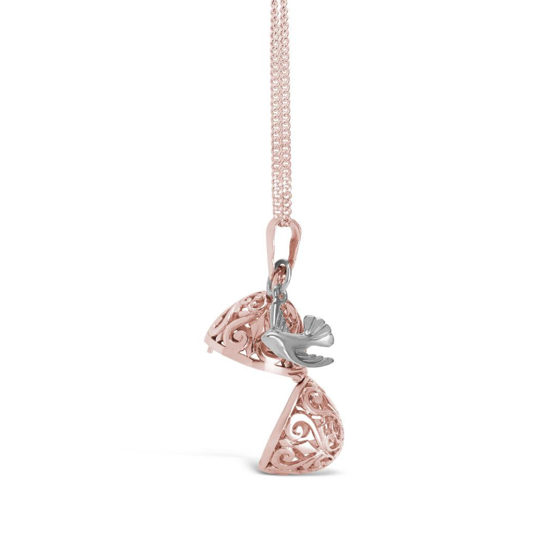opened bird locket in rose gold with silver charm