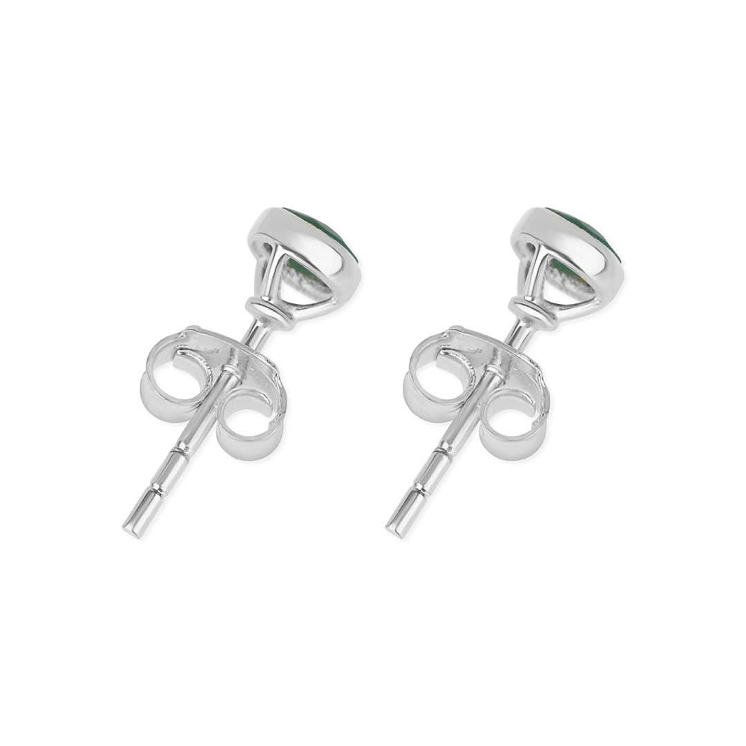 Blue topaz mini stud earrings in silver facing the back on a white background