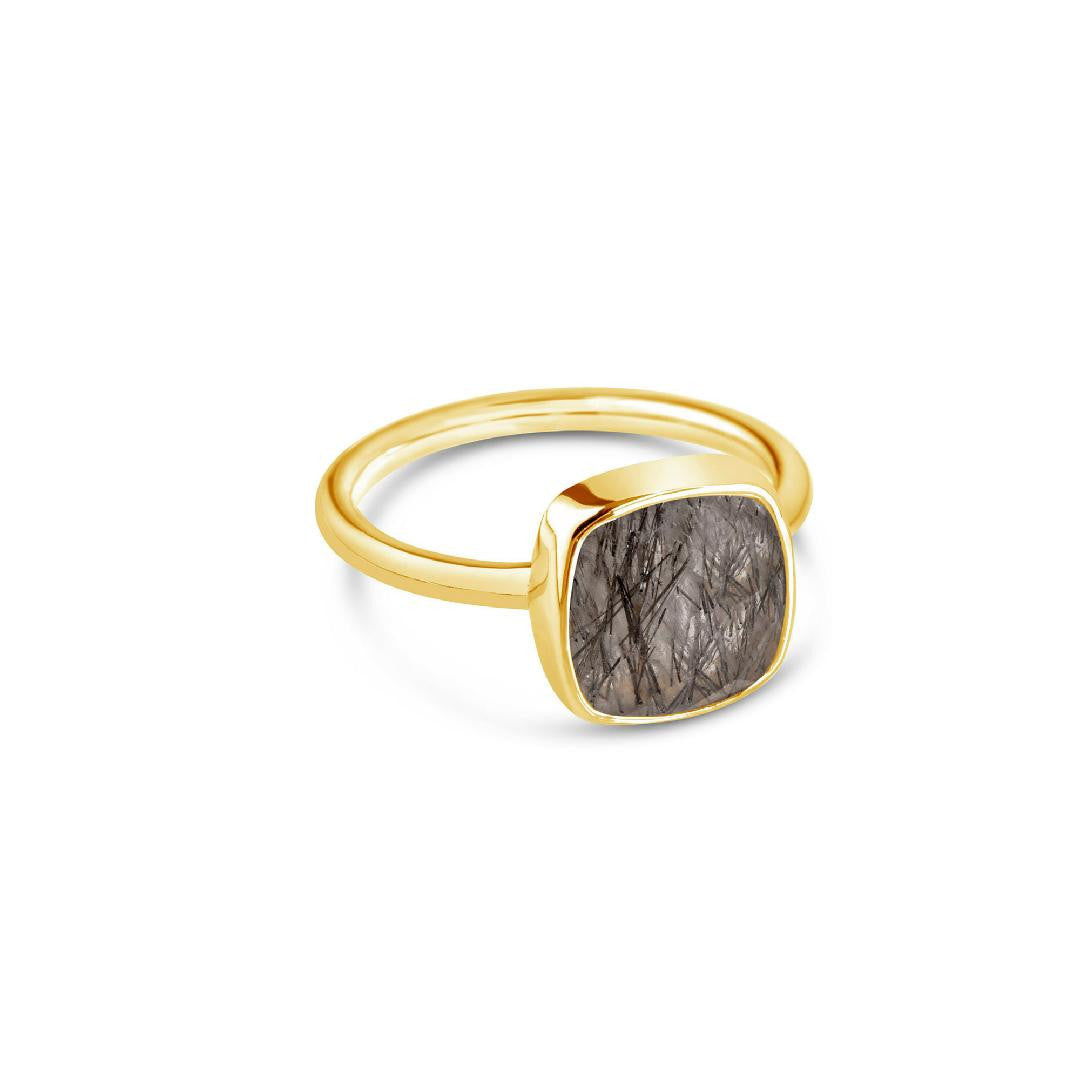 rutilated quartz cocktail ring in gold on a white background