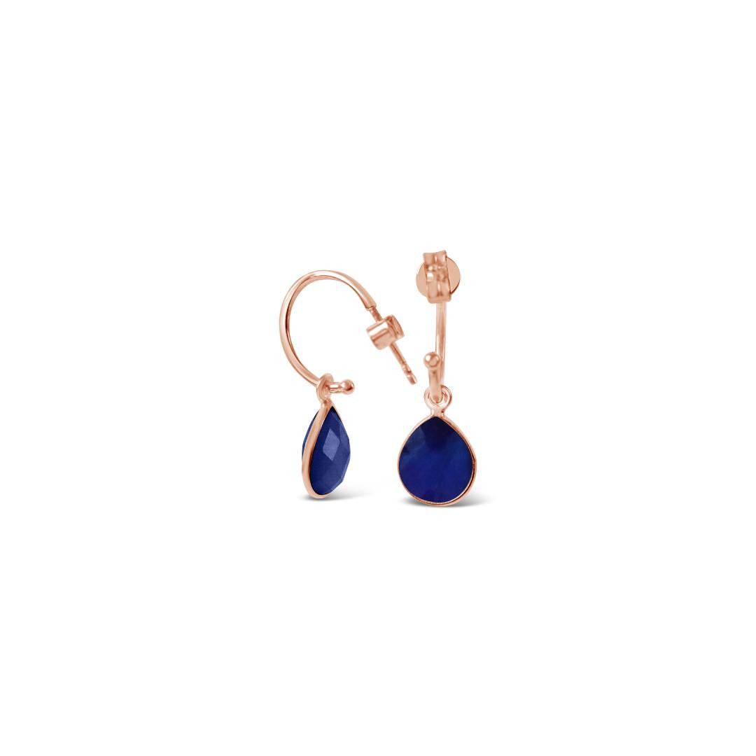 sapphire drop hoop earrings in rose gold on a white background
