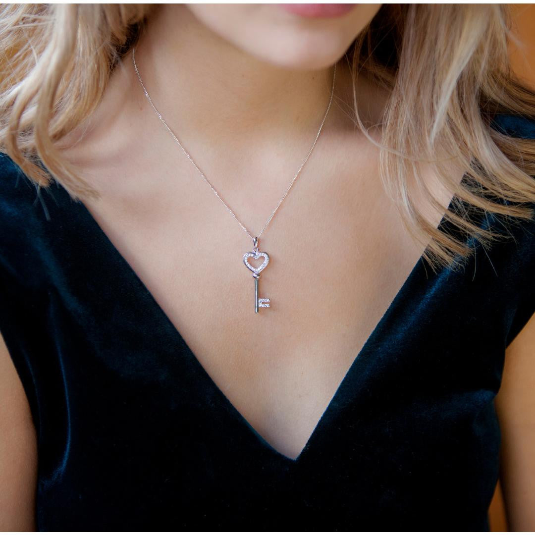 model wearing love key pendant in silver