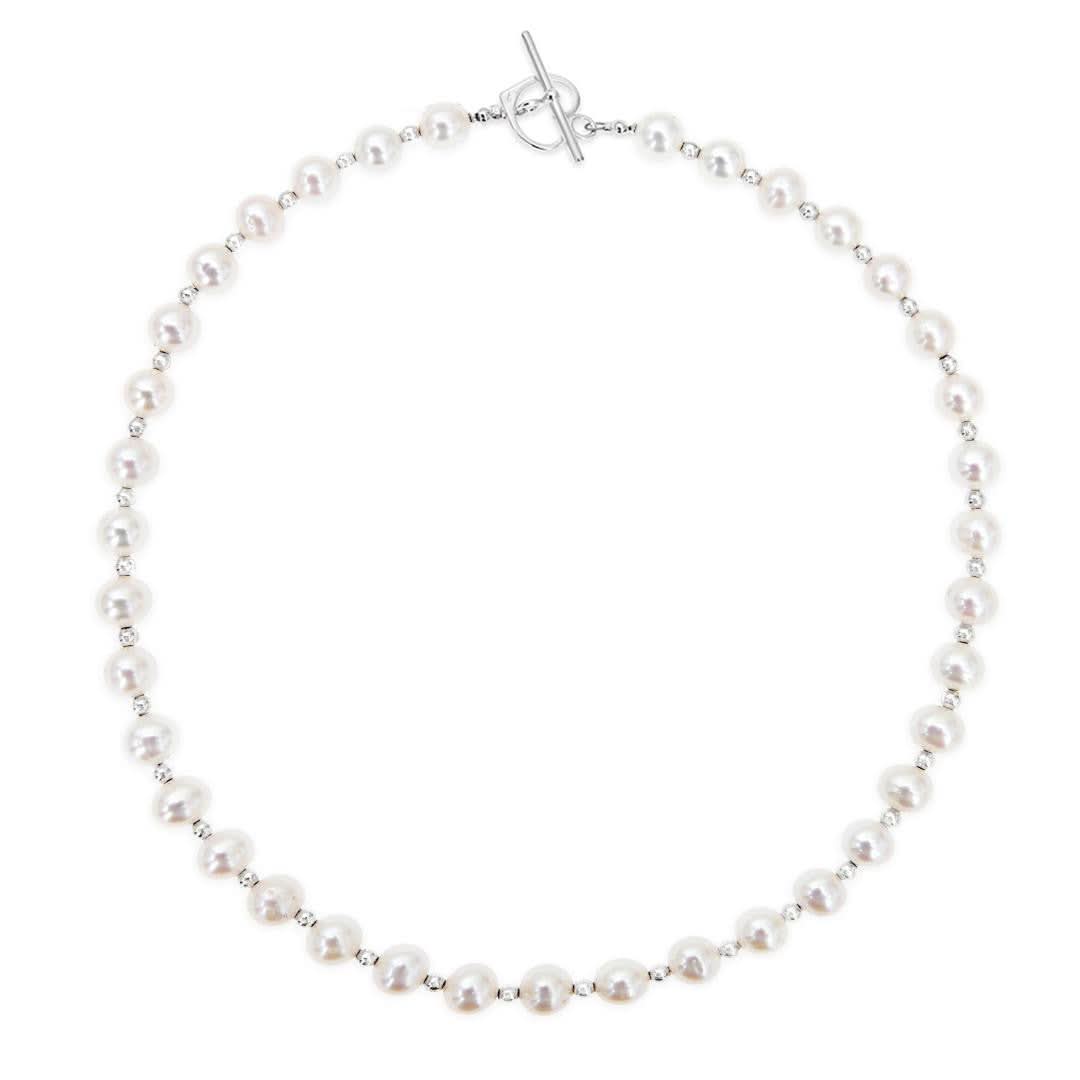 A sterling silver necklace featuring freshwater pearls and sterling silver balls, with a sterling silver heart clasp.