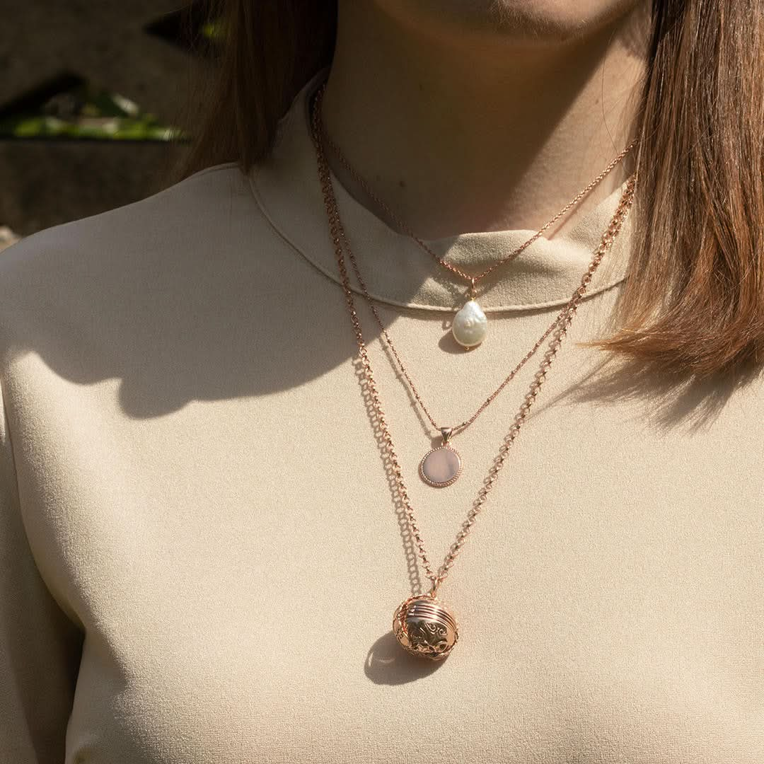 model wearing rose gold memory keeper locket