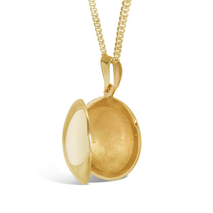opened men's round locket necklace in gold on a white background 