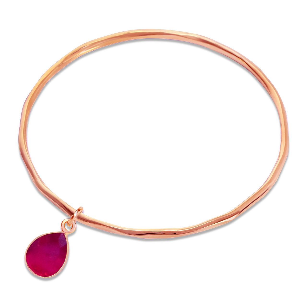ruby charm bangle in rose gold on a white background
