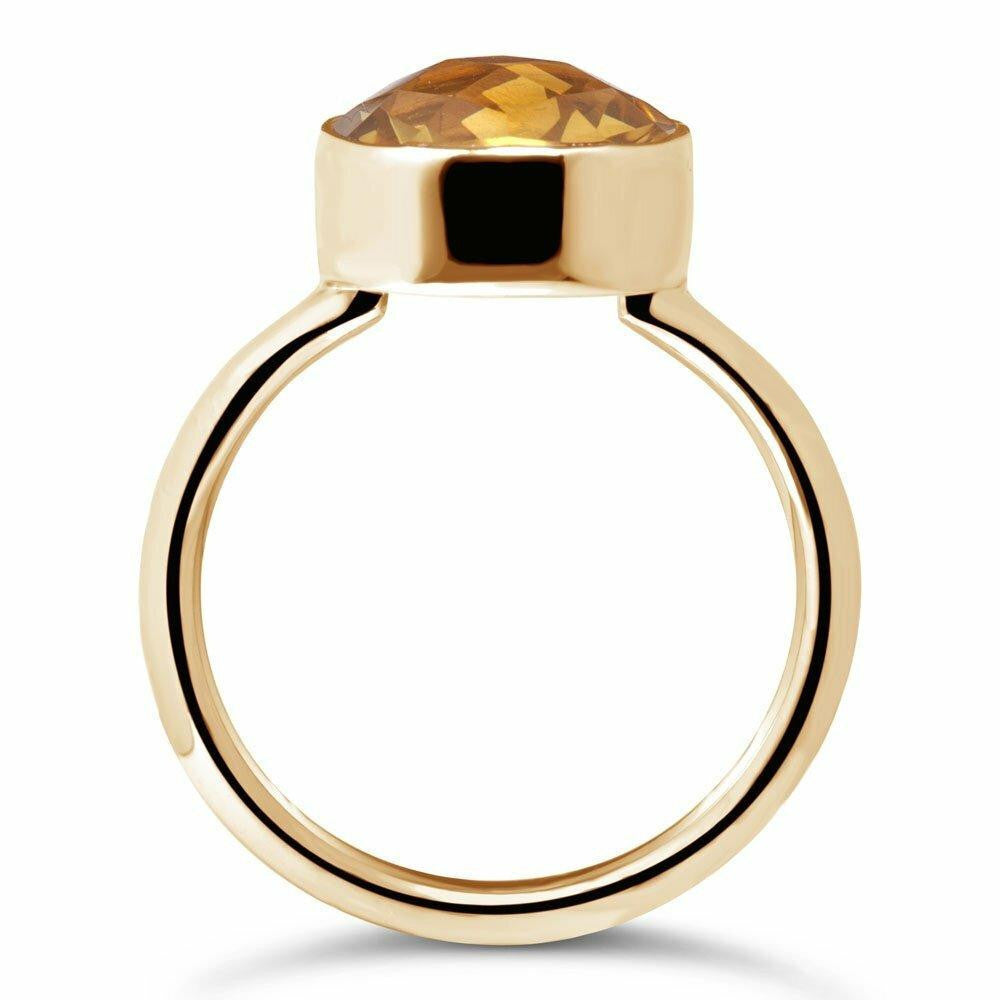 citrine cocktail ring in gold on a white background