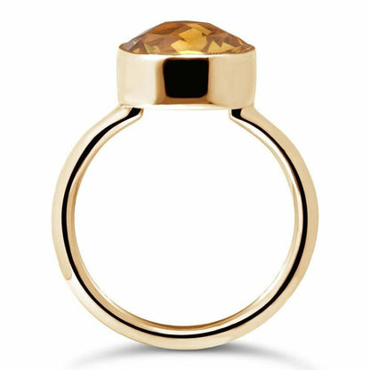 citrine cocktail ring in gold on a white background