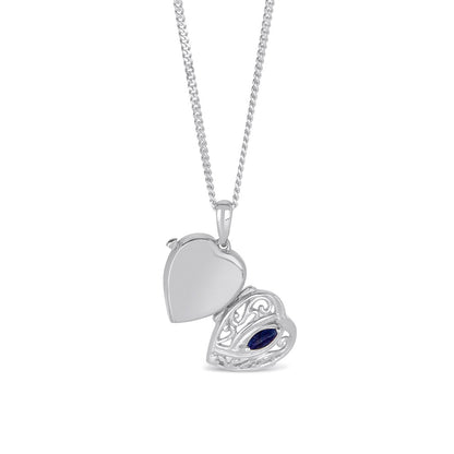 opened sapphire heart locket in silver on a white background
