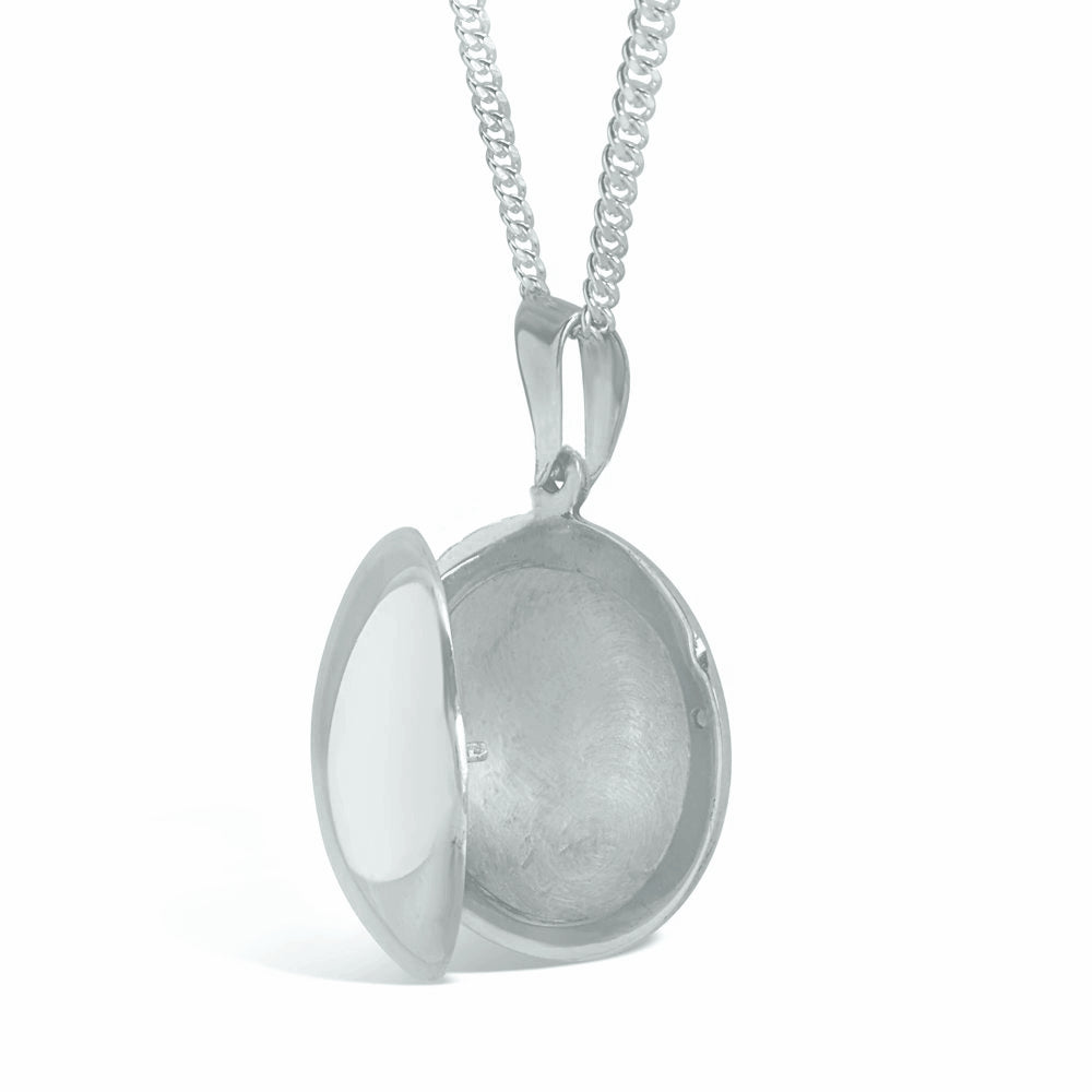men's round locket necklace in silver on a white background