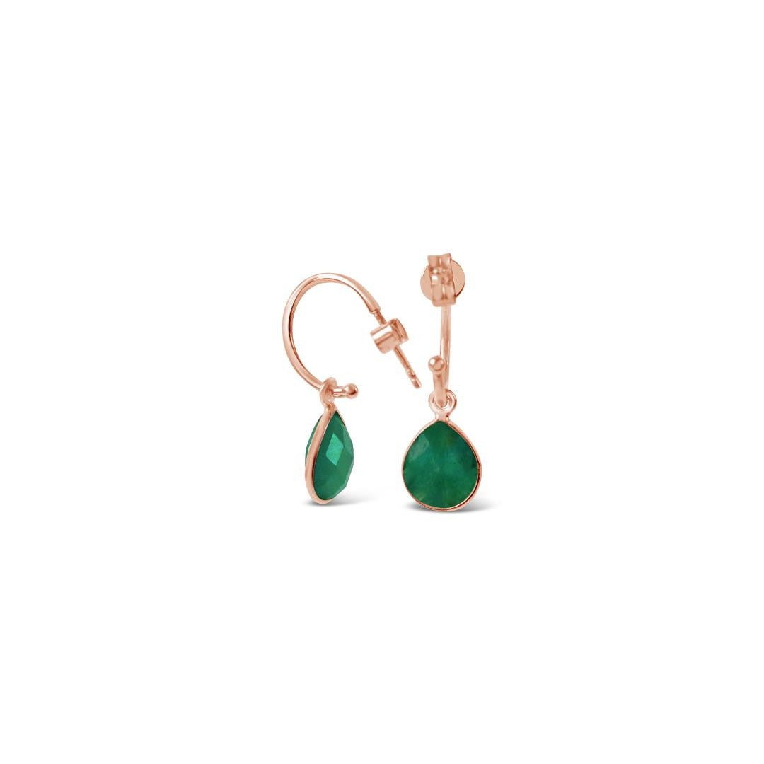 emerald drop hoop earrings in rose gold on a white background