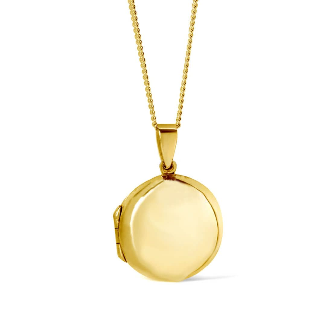 round locket necklace in gold on a white background