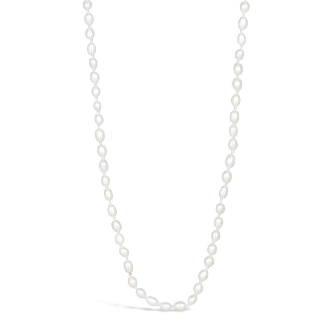 Ivory seed pearl necklace on a white background