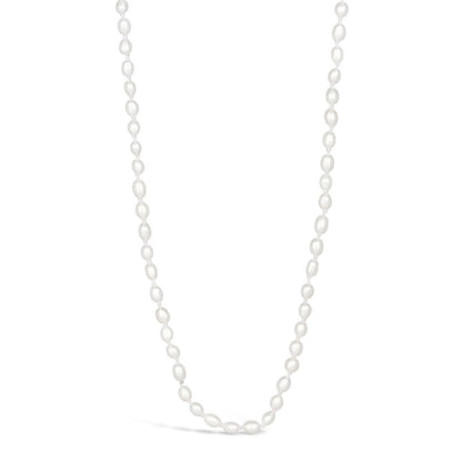 Ivory seed pearl necklace on a white background