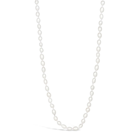Ivory seed pearl necklace on a white background