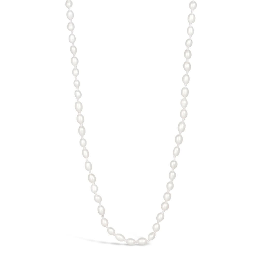 Ivory seed pearl necklace on a white background