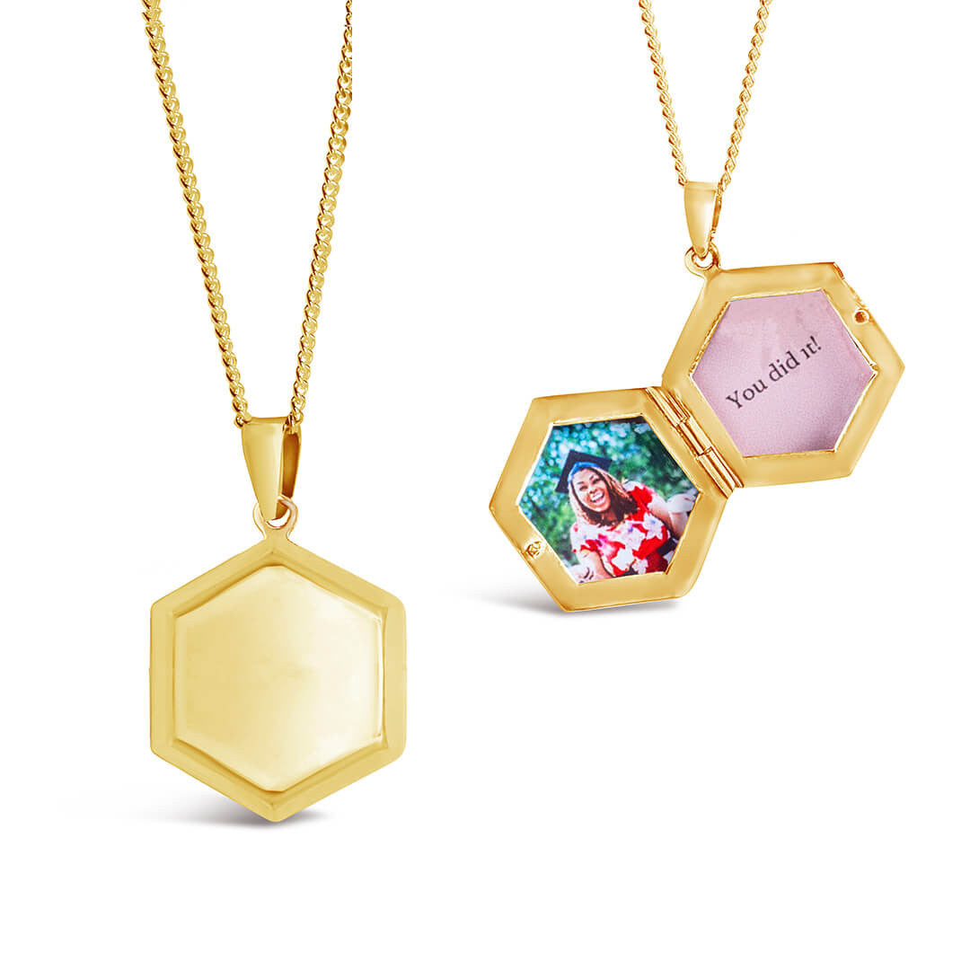 hexagon shaped locket in gold with an inside and outside view of locket