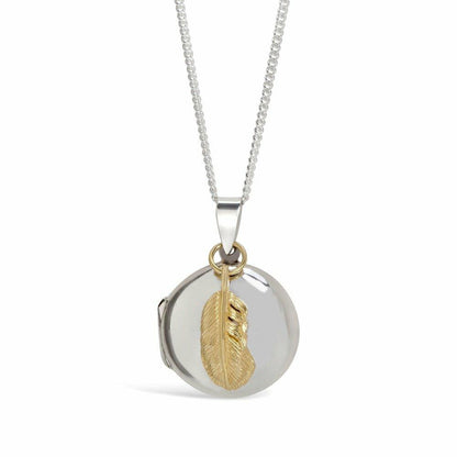 feather locket in silver with gold feather charm on a white background