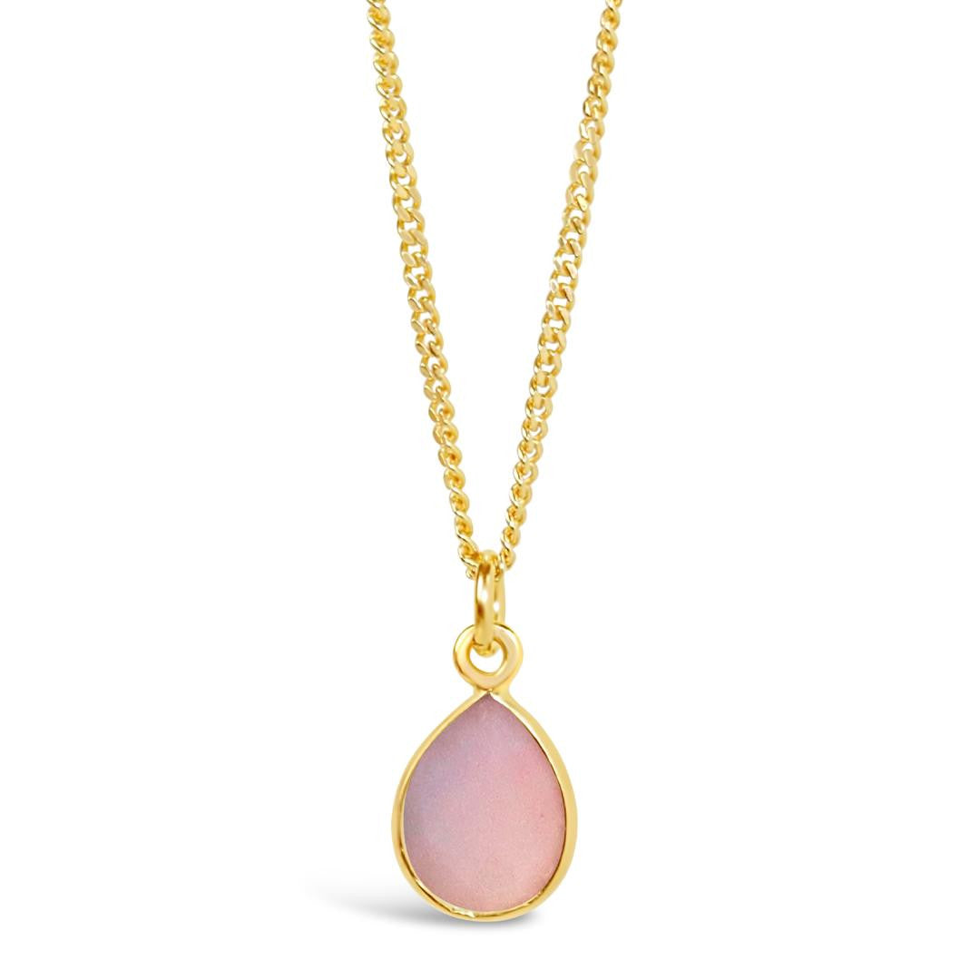 pink opal charm necklace in gold on a white background