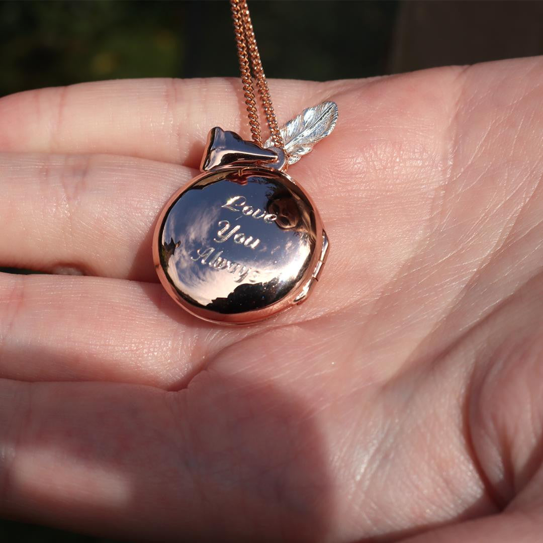 rose gold feather locket with silver feather charm engraved with message