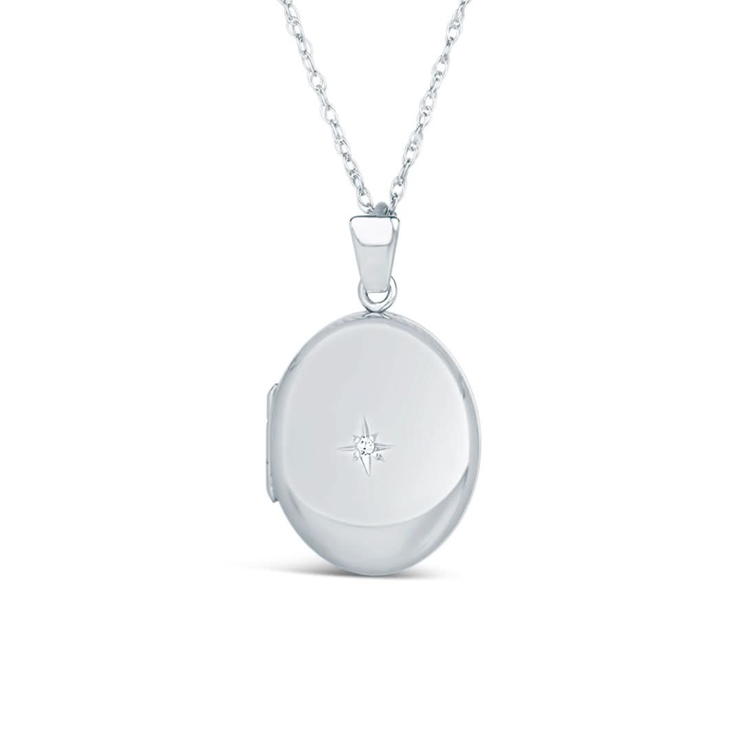 solid white gold diamond oval locket on a white background