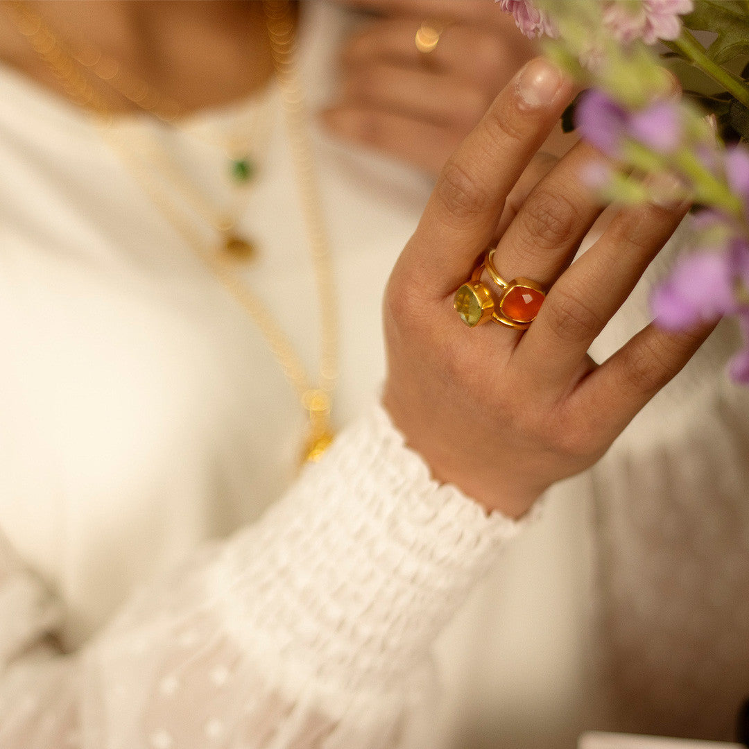 close up of model wearing carnelian cocktail ring in rose gold