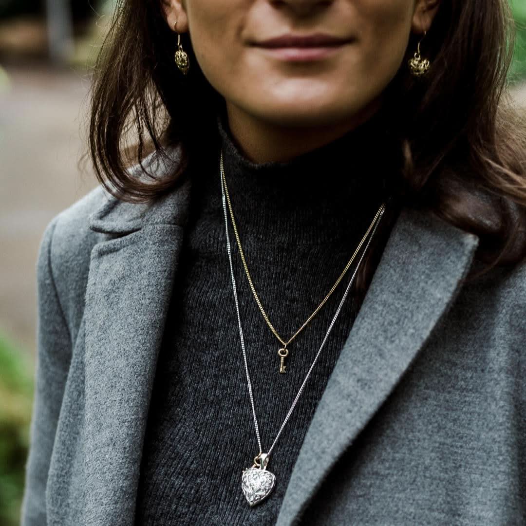model wearing key pendant in gold 