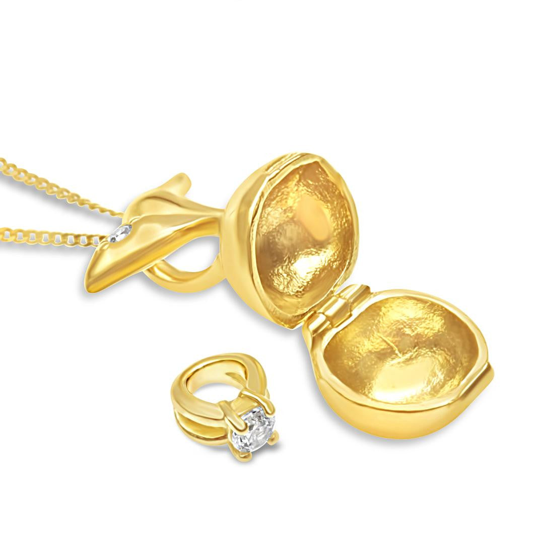 opened magical apple charm in gold on a white background