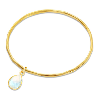 moonstone charm bangle in gold on a white background