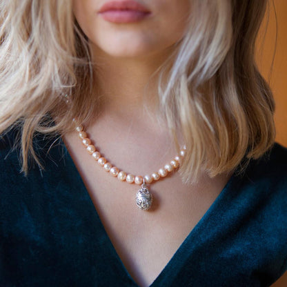 model wearing keepsake egg necklace in champagne
