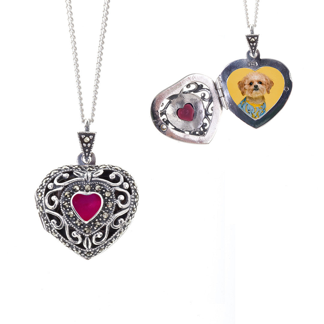 ruby vintage heart locket in silver with photo of dog inside on a white background