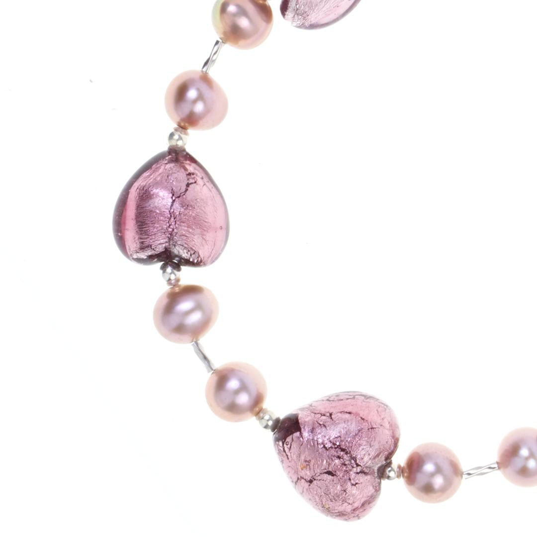 close up of dusk pearl heart bracelet on a white background