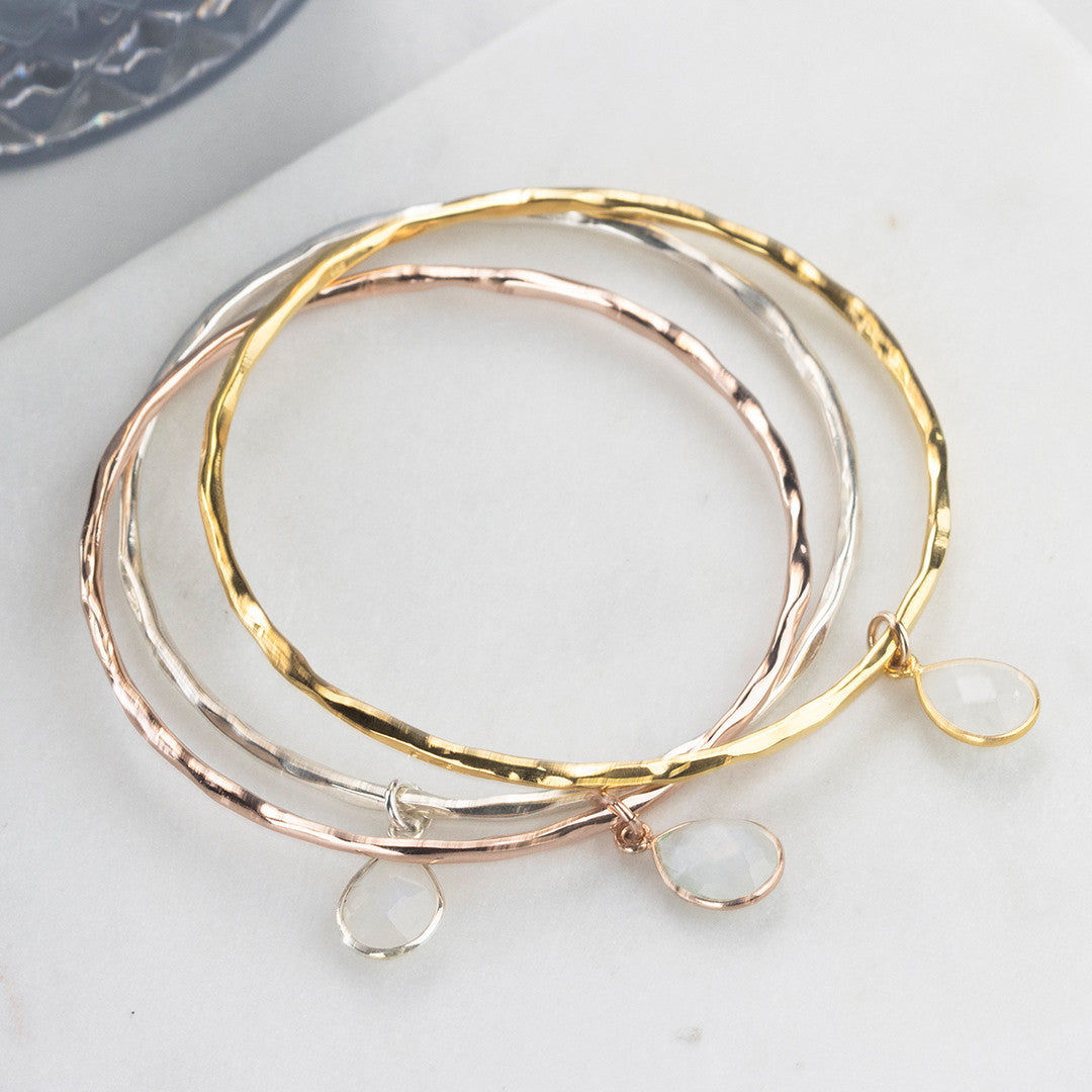 moonstone charm bangles in silver, gold and rose gold