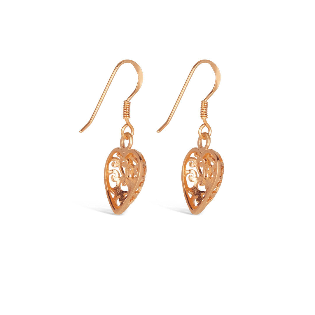 rose gold heart earrings on a white background
