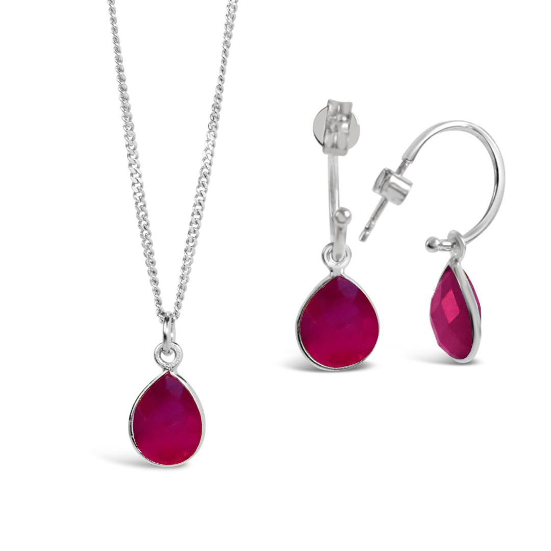 Lily Blanche silver necklace and hoop earrings with ruby gemstone charms
