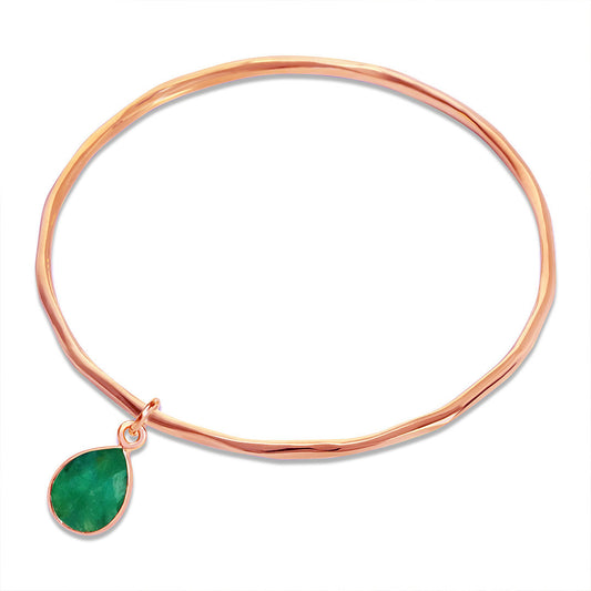 Thin rose gold bangle with tear drop emerald