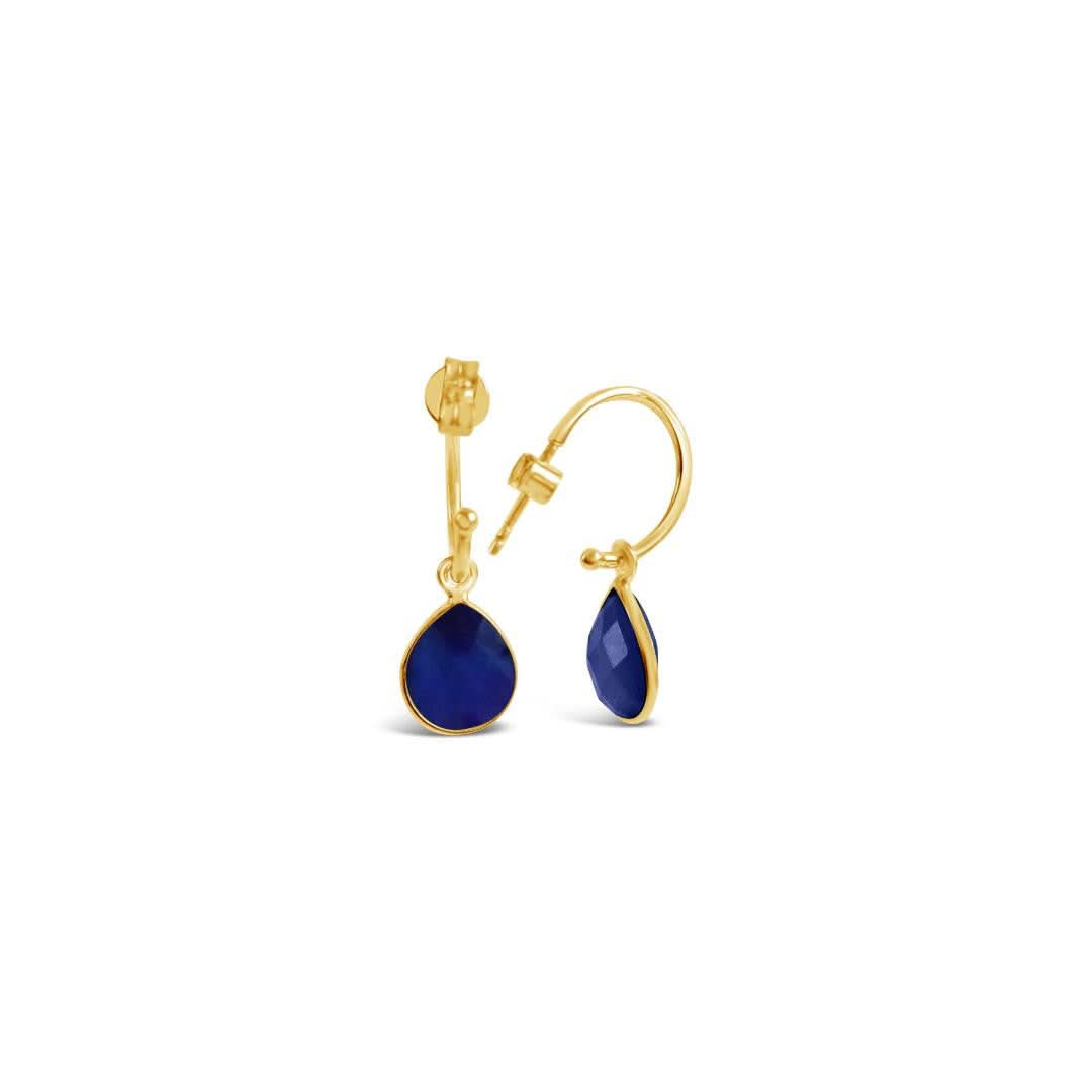 sapphire drop hoop earrings on a white background