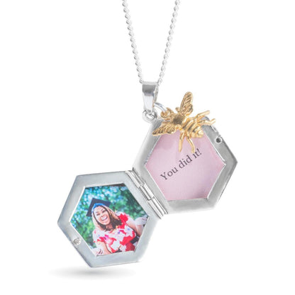 opened bee locket in silver with gold bee charm on a white background